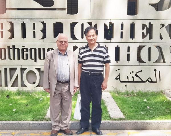 納比勒·蘇萊曼（左）與薛慶國